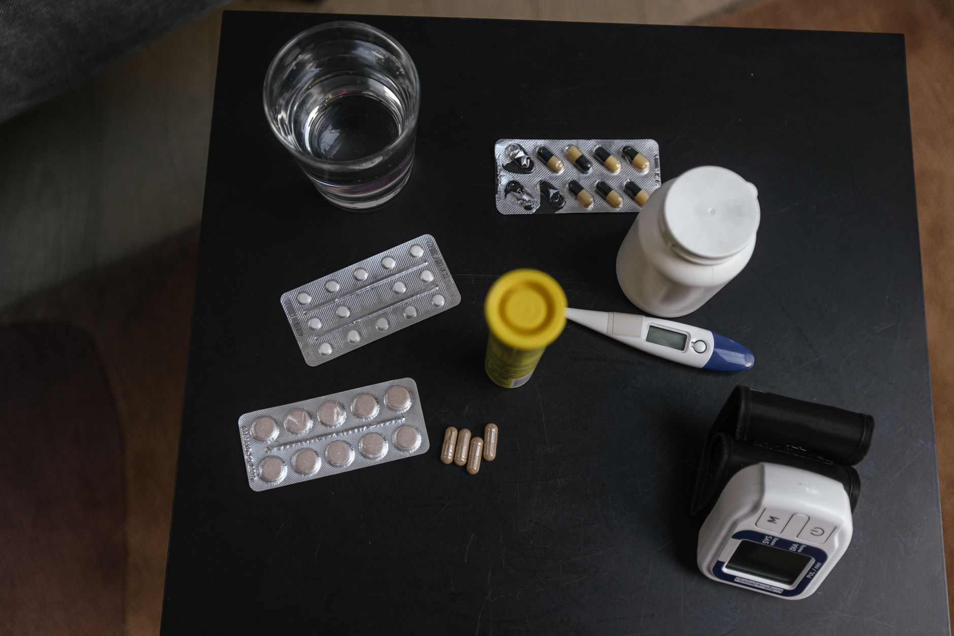 Prescription medication bottles and pills on a table