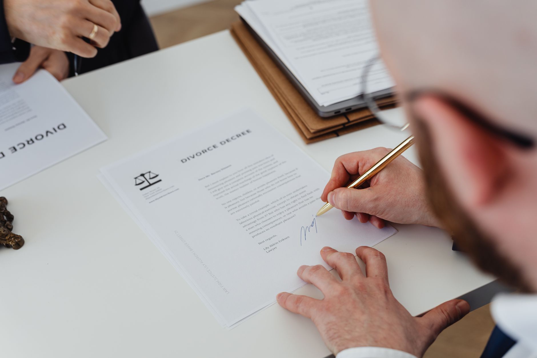 Signing an official document with a pen