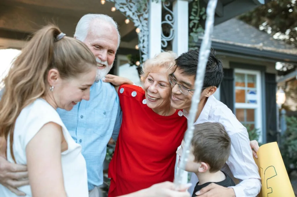 A South Florida family of three smiling together at home